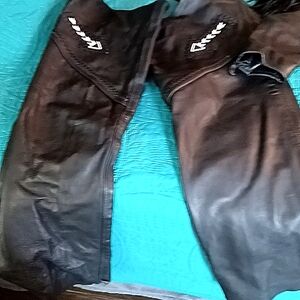 This is a leather motorcycle jacket with a pair of chaps. Size 10/12